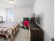 Bedroom with a double bed, dresser, and large TV at 467 Eagleview Drive, Moncks Corner, SC 29461