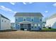 Two-story blue house with screened porch and backyard at 467 Eagleview Drive, Moncks Corner, SC 29461