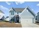 Two-story home with blue siding, white trim, and a two-car garage at 467 Eagleview Drive, Moncks Corner, SC 29461