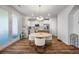 Kitchen with white cabinets, round dining table, and hardwood floors at 467 Eagleview Drive, Moncks Corner, SC 29461