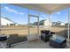 Relaxing screened porch with wicker furniture and view of backyard at 467 Eagleview Drive, Moncks Corner, SC 29461