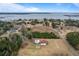 Aerial view showcasing home, pool, and waterfront property at 4712 Westervelt Rd, Meggett, SC 29449