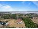 Aerial view showing house and expansive waterfront lot at 4712 Westervelt Rd, Meggett, SC 29449