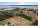 Aerial view of house, pool, and expansive property overlooking the water at 4712 Westervelt Rd, Meggett, SC 29449