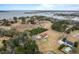 Aerial view of waterfront property with house and pool at 4712 Westervelt Rd, Meggett, SC 29449