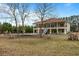 House with a large backyard, inground pool, and mature trees at 4712 Westervelt Rd, Meggett, SC 29449