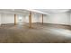 Finished basement with neutral carpeting and exposed beams at 4712 Westervelt Rd, Meggett, SC 29449
