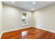 Bright bedroom with hardwood floors and a large window at 4712 Westervelt Rd, Meggett, SC 29449