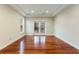 Bedroom with hardwood floors and French doors leading to a balcony at 4712 Westervelt Rd, Meggett, SC 29449