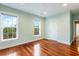 Bright bedroom with hardwood floors and two windows at 4712 Westervelt Rd, Meggett, SC 29449