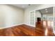 Bedroom with hardwood floors and French doors leading to a deck at 4712 Westervelt Rd, Meggett, SC 29449