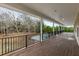 Large deck overlooks private backyard pool and wooded area at 4712 Westervelt Rd, Meggett, SC 29449