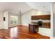 Kitchen with dark wood cabinets, granite countertops, and an island at 4712 Westervelt Rd, Meggett, SC 29449