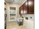 Laundry room with utility sink and built-in cabinets at 4712 Westervelt Rd, Meggett, SC 29449
