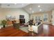 Spacious living room with hardwood floors, fireplace, and access to a balcony at 4712 Westervelt Rd, Meggett, SC 29449
