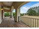 Covered porch with wood flooring and scenic view at 4712 Westervelt Rd, Meggett, SC 29449