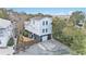 Aerial view of two-story home with private yard and parking at 79 Sandbar Ln, Folly Beach, SC 29439