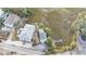 Aerial view of two houses near the marsh, with a street and surrounding neighborhood visible at 79 Sandbar Ln, Folly Beach, SC 29439