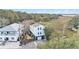 Aerial view of two-story home with private yard at 79 Sandbar Ln, Folly Beach, SC 29439