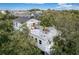 White two-story home with rooftop deck and outdoor seating at 79 Sandbar Ln, Folly Beach, SC 29439