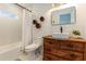 Bathroom with unique wooden vanity and vessel sink at 79 Sandbar Ln, Folly Beach, SC 29439