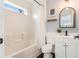 Bathroom with shower/tub combo, white vanity, and dark hardware at 79 Sandbar Ln, Folly Beach, SC 29439