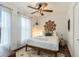 Bedroom with full-size bed, ceiling fan, and rug at 79 Sandbar Ln, Folly Beach, SC 29439