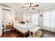 Bedroom with queen-size bed and wood floors at 79 Sandbar Ln, Folly Beach, SC 29439