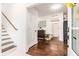 Bright entryway with hardwood floors and powder room at 79 Sandbar Ln, Folly Beach, SC 29439