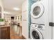Laundry room with washer and dryer, and stylish wallpaper at 79 Sandbar Ln, Folly Beach, SC 29439