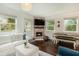 Living room with fireplace, hardwood floors, and comfy seating at 79 Sandbar Ln, Folly Beach, SC 29439