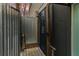 Private outdoor shower with corrugated metal wall at 79 Sandbar Ln, Folly Beach, SC 29439