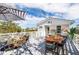 Stylish rooftop deck features a dining area and comfy seating at 79 Sandbar Ln, Folly Beach, SC 29439