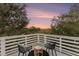 Secluded rooftop deck with scenic views and seating at 79 Sandbar Ln, Folly Beach, SC 29439