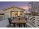 Rooftop deck with wooden dining table and stylish chairs at 79 Sandbar Ln, Folly Beach, SC 29439