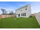 Spacious backyard with a wood fence and grassy lawn at 8700 Forte Dr, North Charleston, SC 29406