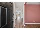 Bright and spacious entryway with dark hardwood floors and a view into the living area at 8700 Forte Dr, North Charleston, SC 29406