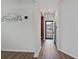 A light-filled hallway with a view into another room at 8700 Forte Dr, North Charleston, SC 29406