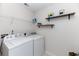Laundry room with washer, dryer, and shelving at 8700 Forte Dr, North Charleston, SC 29406