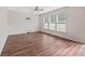 Spacious living room with hardwood floors and large windows at 8700 Forte Dr, North Charleston, SC 29406