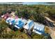 Aerial view of luxury homes with blue roofs surrounded by lush greenery at 9005 Stern Aly, Johns Island, SC 29455