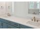 Bathroom featuring a double vanity with blue cabinets, gold hardware and quartz countertops at 9005 Stern Aly, Johns Island, SC 29455