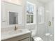 Stylish bathroom with a white subway tile shower, quartz countertop and bronze fixtures at 9005 Stern Aly, Johns Island, SC 29455