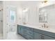 Bright bathroom with double vanity, modern fixtures and a glass-enclosed shower at 9005 Stern Aly, Johns Island, SC 29455