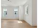 A bright and spacious bedroom featuring three windows and hardwood flooring at 9005 Stern Aly, Johns Island, SC 29455