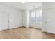 Clean bedroom with white walls, hardwood floors, and natural light at 9005 Stern Aly, Johns Island, SC 29455