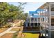Community view of a beautiful property with multiple homes and landscaped path at 9005 Stern Aly, Johns Island, SC 29455