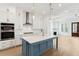 Beautiful kitchen featuring custom cabinets, a blue island, stainless appliances, and hardwood floors at 9005 Stern Aly, Johns Island, SC 29455