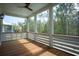 Relax on this screened porch with wood floors and views of the forest at 9005 Stern Aly, Johns Island, SC 29455