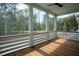 Enjoy wooded views from this relaxing screened porch with wood floors at 9005 Stern Aly, Johns Island, SC 29455